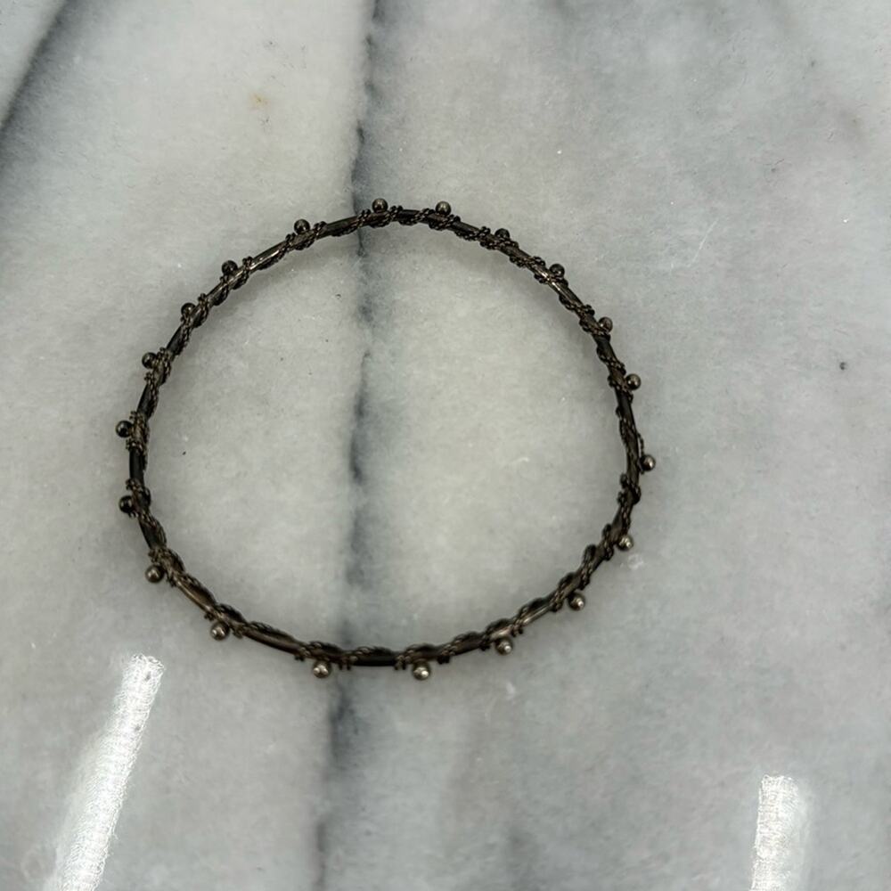 Silver tone wire wrapped bangle bracelet